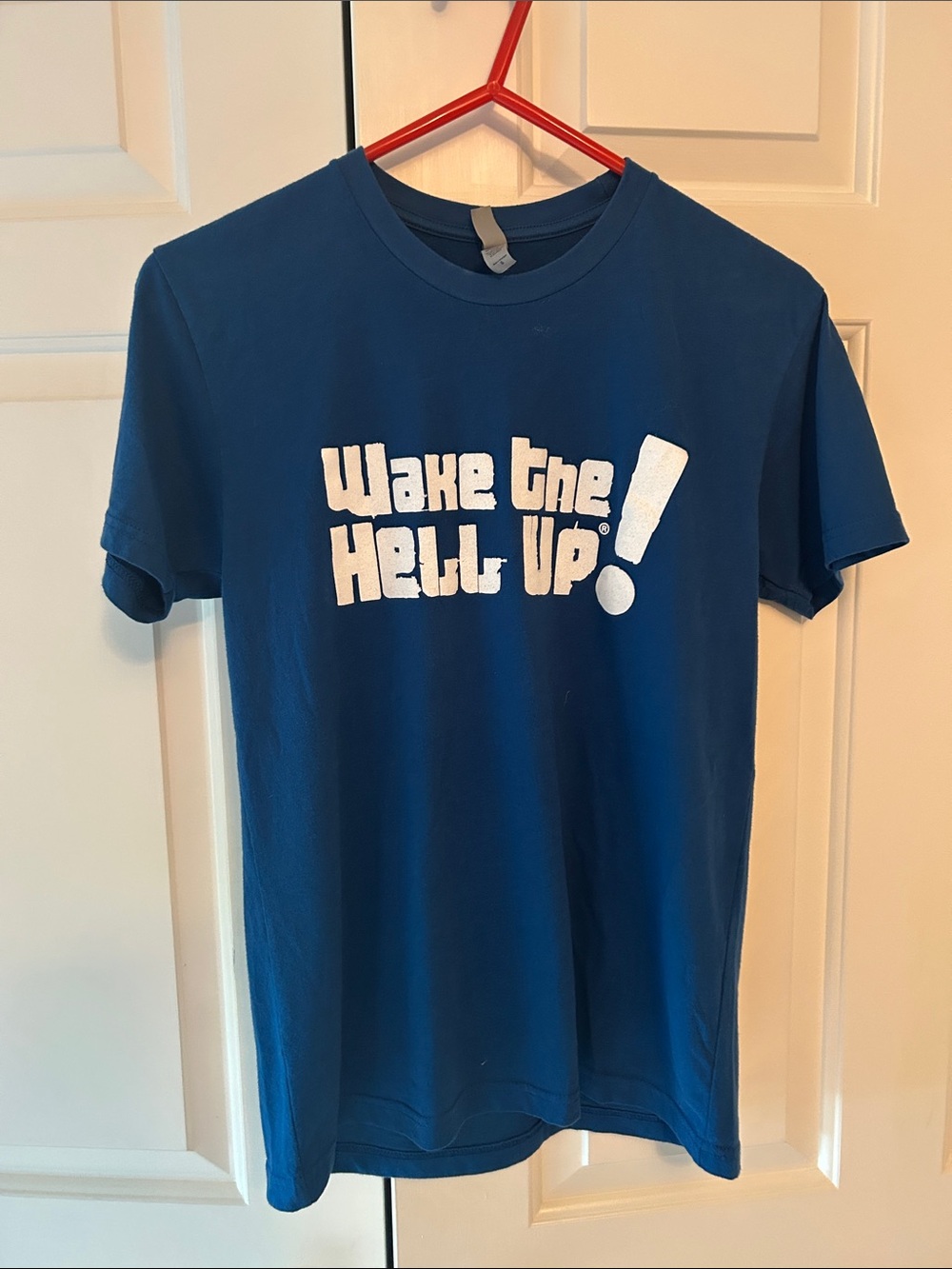 Next Level Apparel Blue Short Sleeve Tee with White "Wake the Hell Up!" Graphic